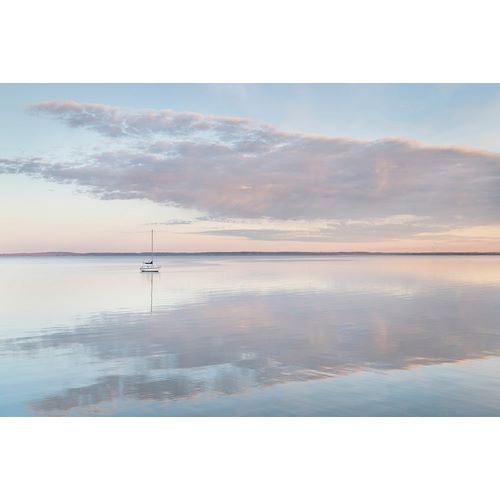 Sailboat and morning clouds reflected in calm waters of Bellingham Bay-Washington State